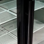 Image of the handle of a bromic BB0330GD-NR-1 under bench display bar fridge.