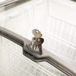 Image of the lock and key feature of the bromic CF0300ATCG-NR chest freezer.