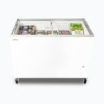 Image of a 352L medium white display chest freezer with a curved glass top, front view with frozen goods inside.