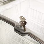 Image of the lock and key feature of the bromic CF0400ATCG-NR chest freezer.