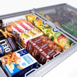 Image of the inside of a 401L medium white display chest freezer with colourful frozen goods inside.