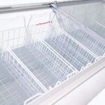 Image of the inside of 401L medium white display chest freezer, lip open.