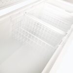 Image of the inside of 492L medium white display chest freezer showcasing baskets, lid open.