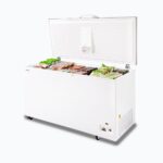 Image of a 492L medium white chest freezer with a stainless steel top, right angled view with frozen goods inside.