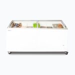 Image of a 555L large white display chest freezer with a curved glass top, front view with frozen goods inside.