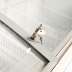 Image of the lock and key feature of the bromic CF0600ATCG-NR chest freezer.
