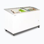 Image of a 555L large white display chest freezer with a curved glass top, left angled view with frozen goods inside.
