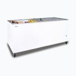 Image of a 670L large white display chest freezer with a flat glass top opened with frozen goods inside.
