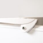 Image of a white handle from a bromic CF0700FTSS-NR chest freezer.