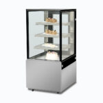 Image of a 660mm wide stainless steel cold food display, right angled view with desserts inside.