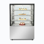Image of a 900mm wide stainless steel cold food display, front view with desserts inside.