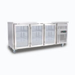 Image of a 417L stainless steel under bench display fridge with three hinged doors, left angled view.