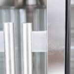 Image of the handle of a bromic UBC2230GD-NR under bench display fridge.