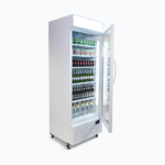 Image of a 690L white upright display fridge with lightbox and one door, left angled view with drinks inisde.