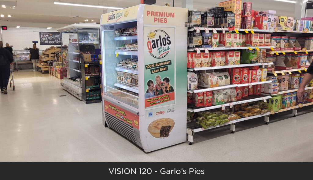 Image of a garlo's pies Bromic open display fridge with branding on the front and side in a supermarket.