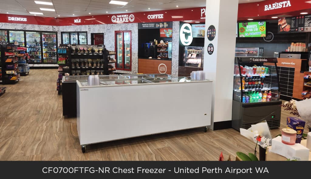 Image of a large Bromic chest freezer in a convenience store.