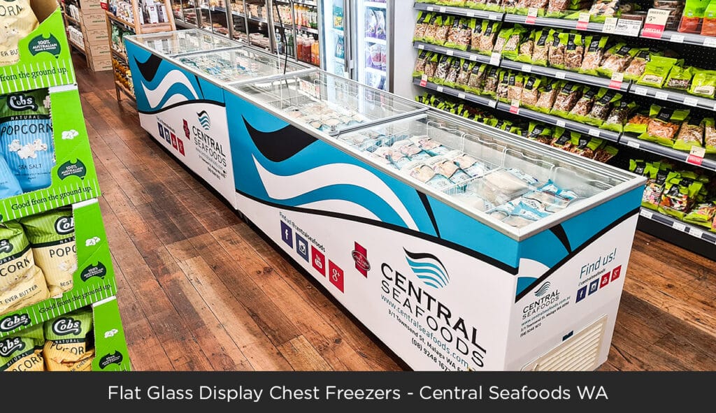 An image of Bromic chest freezers with Central Seafood decaling in a grocery store.